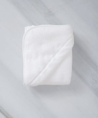 Baby Hooded Towel in white, detail shot from hood and DOUXE logo with marble background