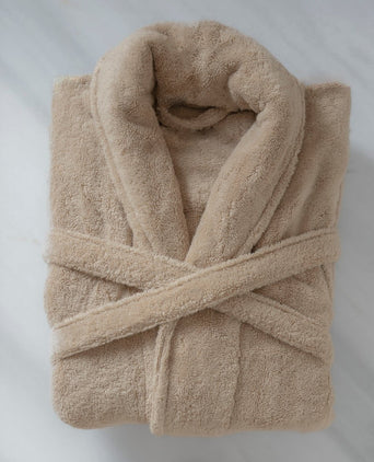 Folded bathrobe hotel quality in latte, flat lay shot