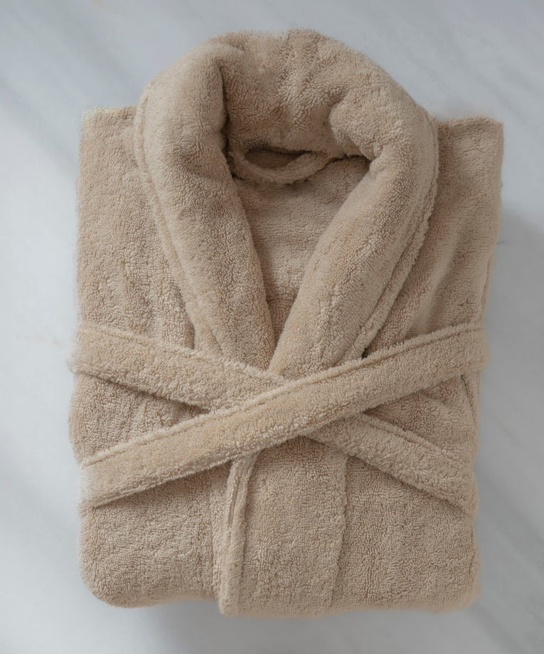 Folded bathrobe hotel quality in latte, flat lay shot