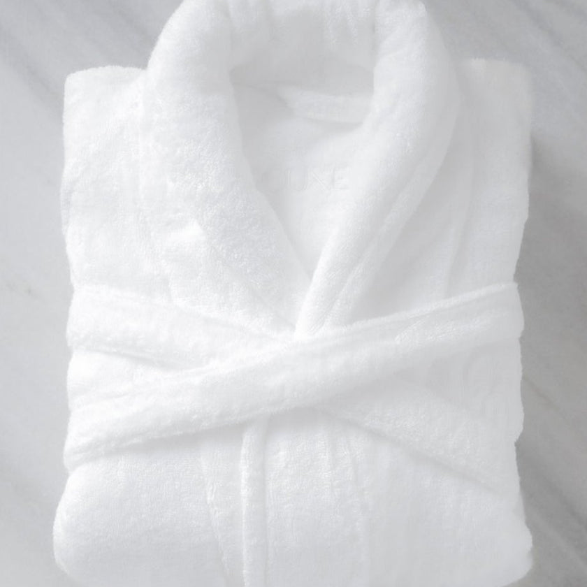 Folded bathrobe hotel quality in white, flat lay shot