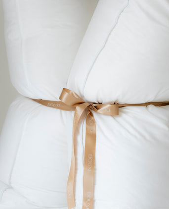 Conservatorium Pillow set, bundled with golden ribbon, zoomed in shot