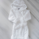 Bathrobe for kids in white with teddy ears, size 8-10 years, flat lay shot